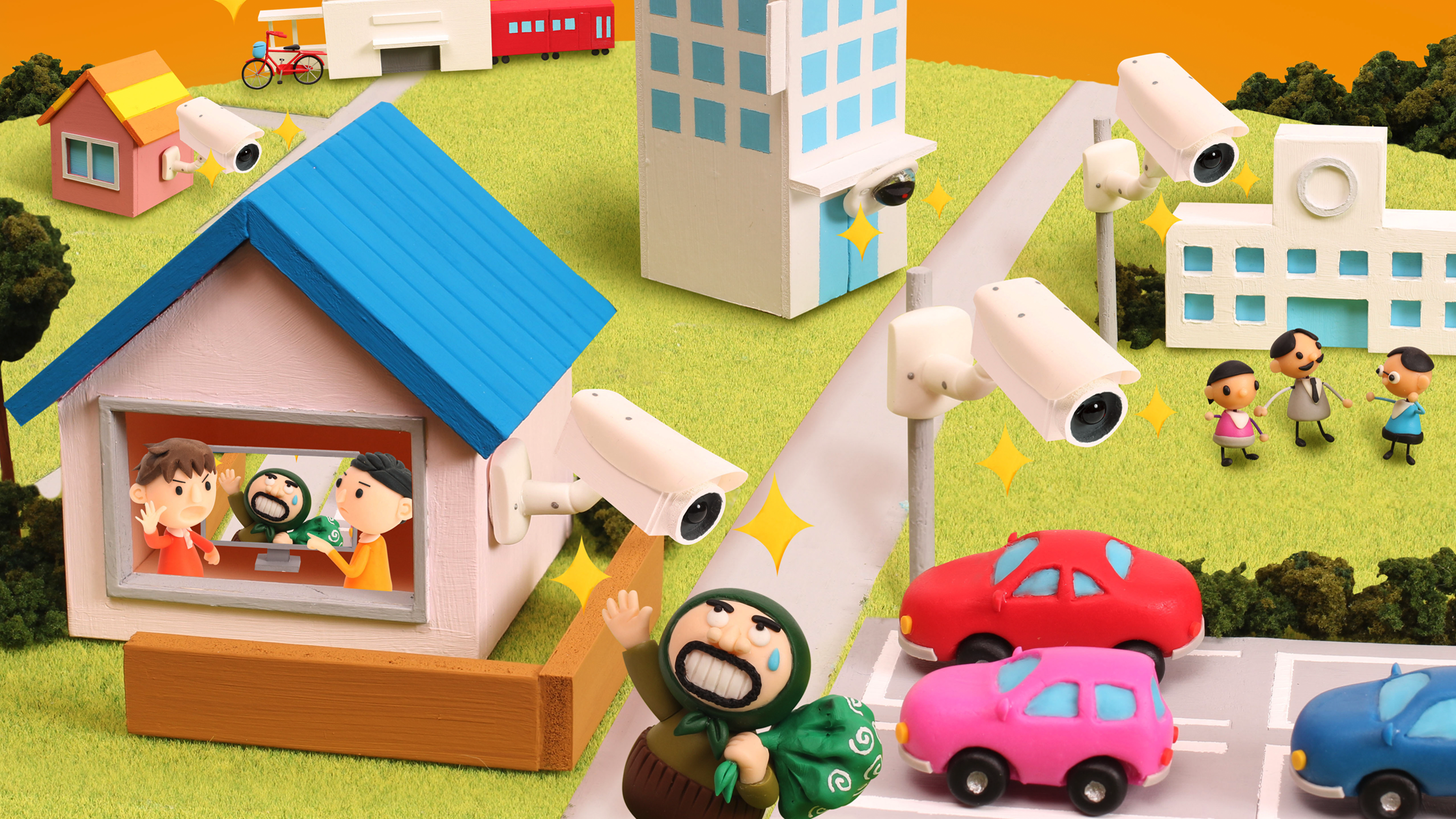 【クレイアート／粘土立体イラスト】<br>ひまわりネットワーク 新聞広告 5月号 “防犯カメラで街の安全をチェックしています” ビジュアル制作