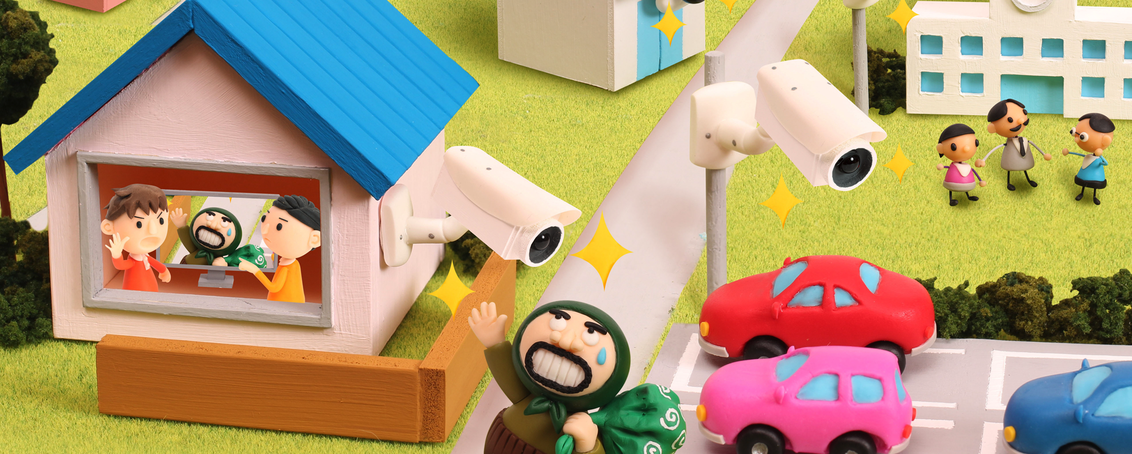 【クレイアート／粘土立体イラスト】<br>ひまわりネットワーク 新聞広告 5月号 “防犯カメラで街の安全をチェックしています” ビジュアル制作